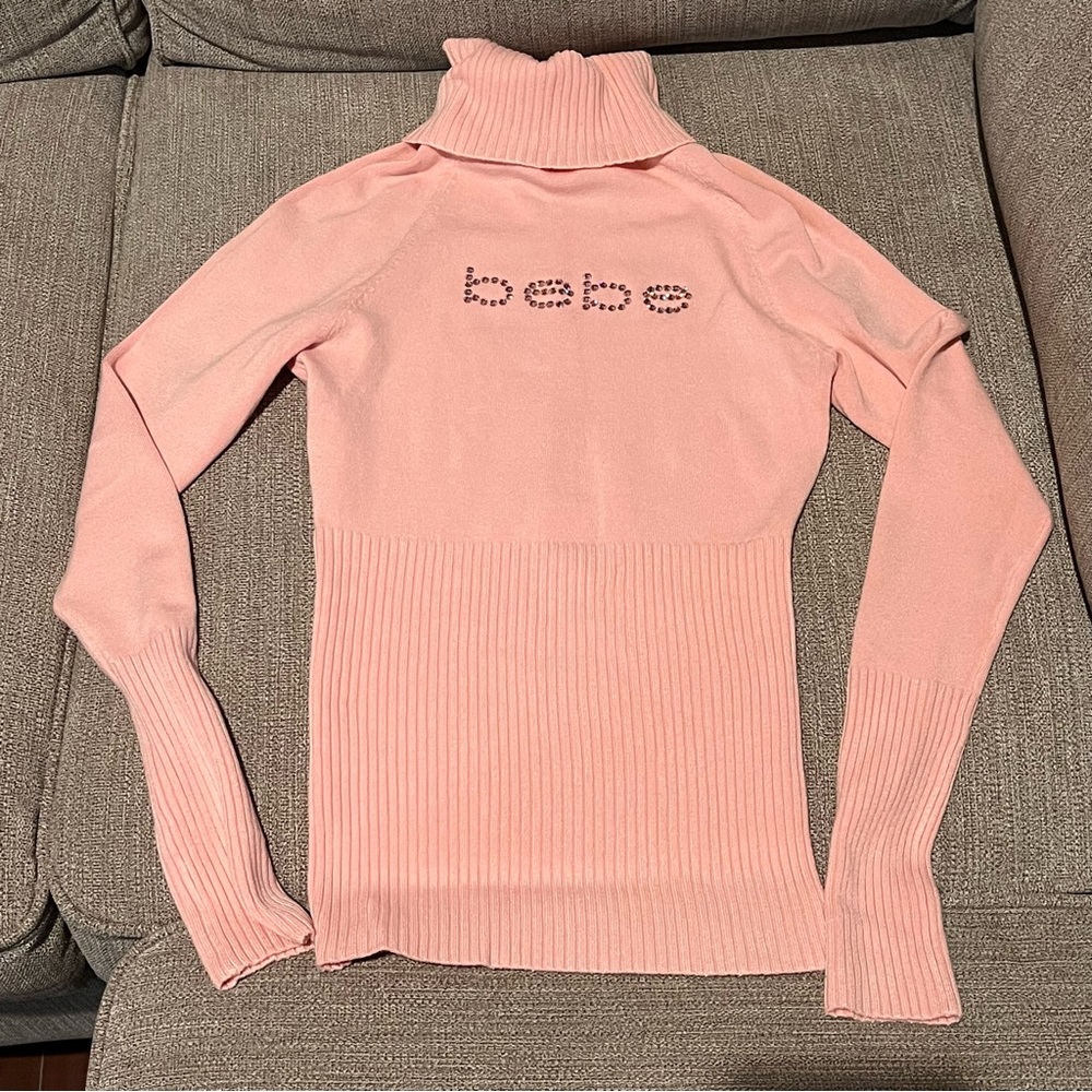Women’s Light Pink Bebe Turtleneck Sweater with Rhinestone Logo